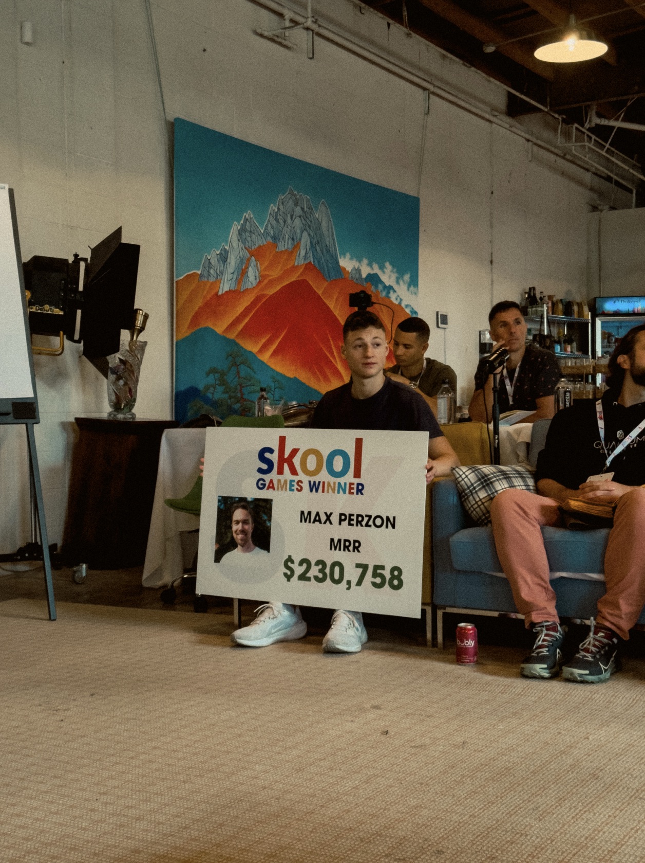 Sign showing $230,758 in monthly recurring revenue