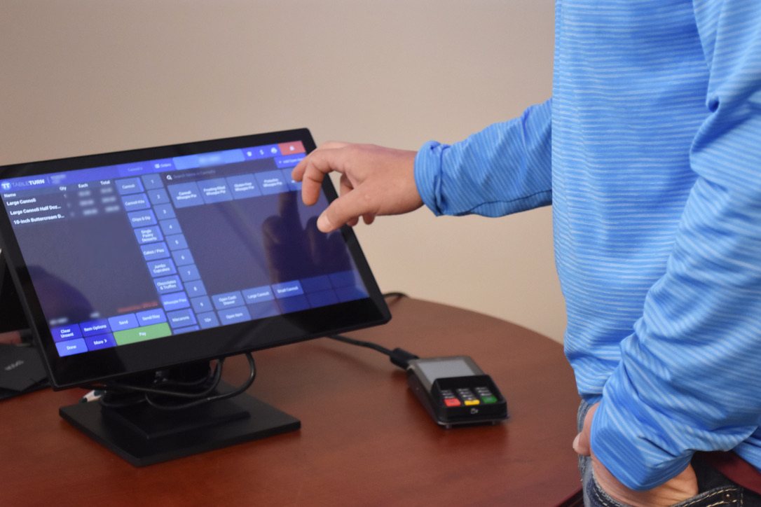 TableTurn touchscreen POS with a card terminal on a counter