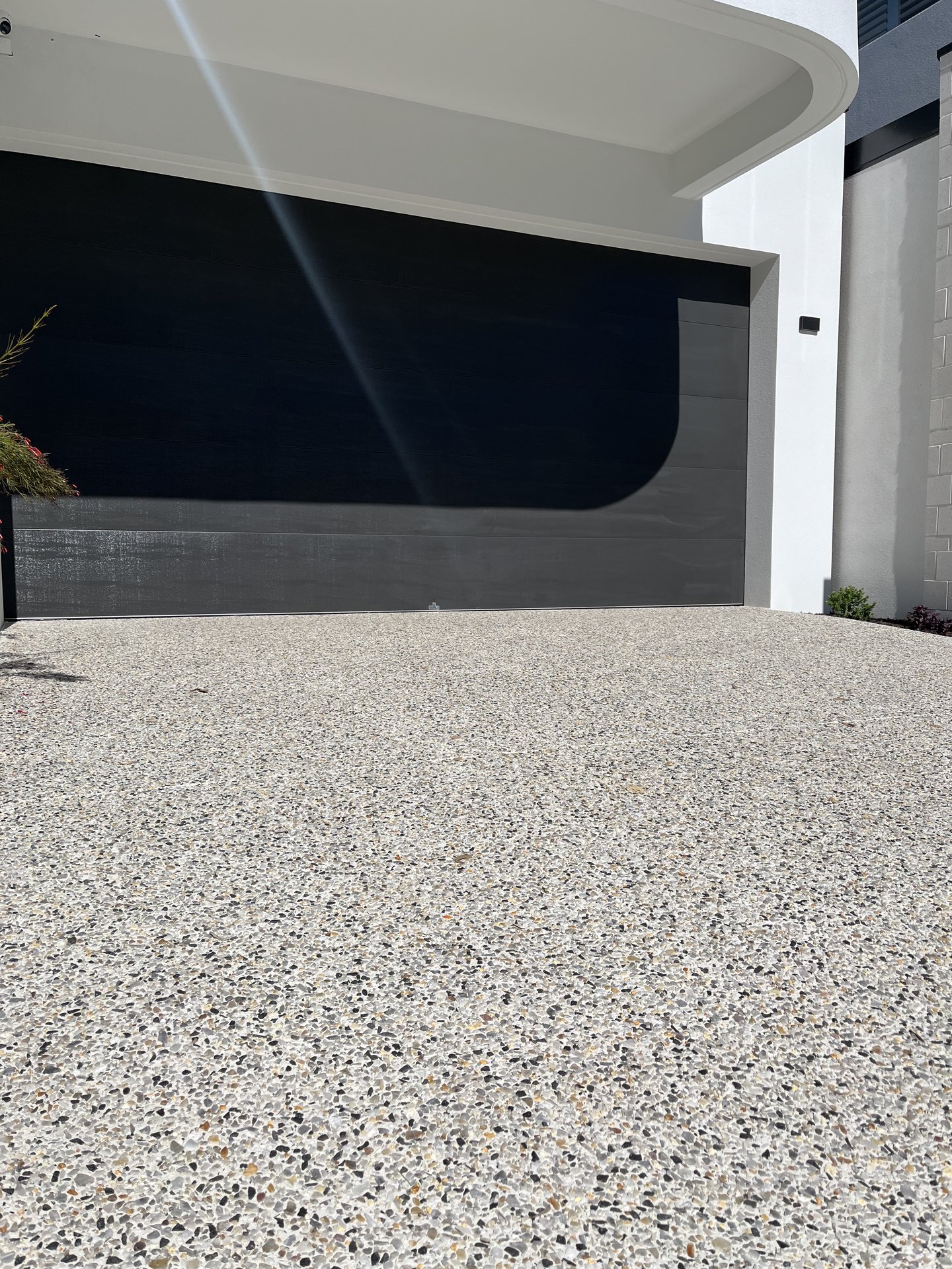 Contemporary architecture and aggregate driveway
