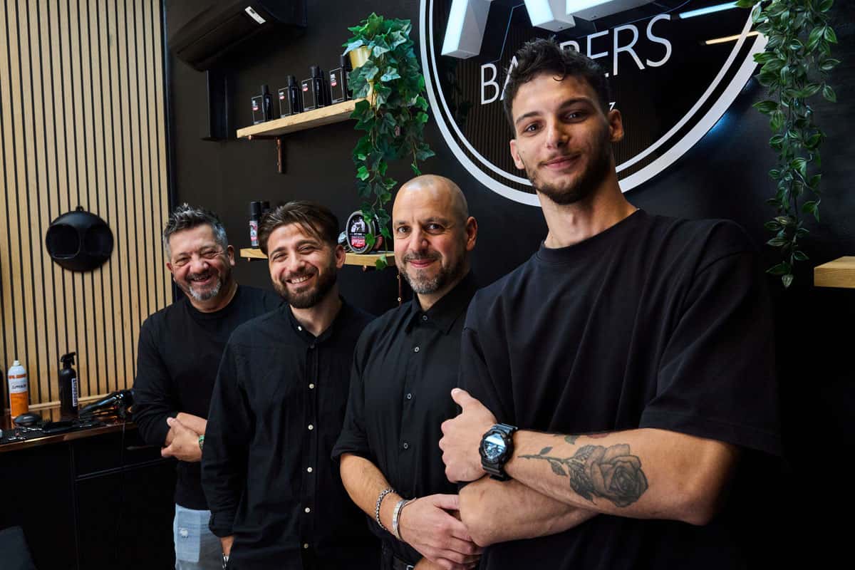 Team at AB Barbers standing next to one another