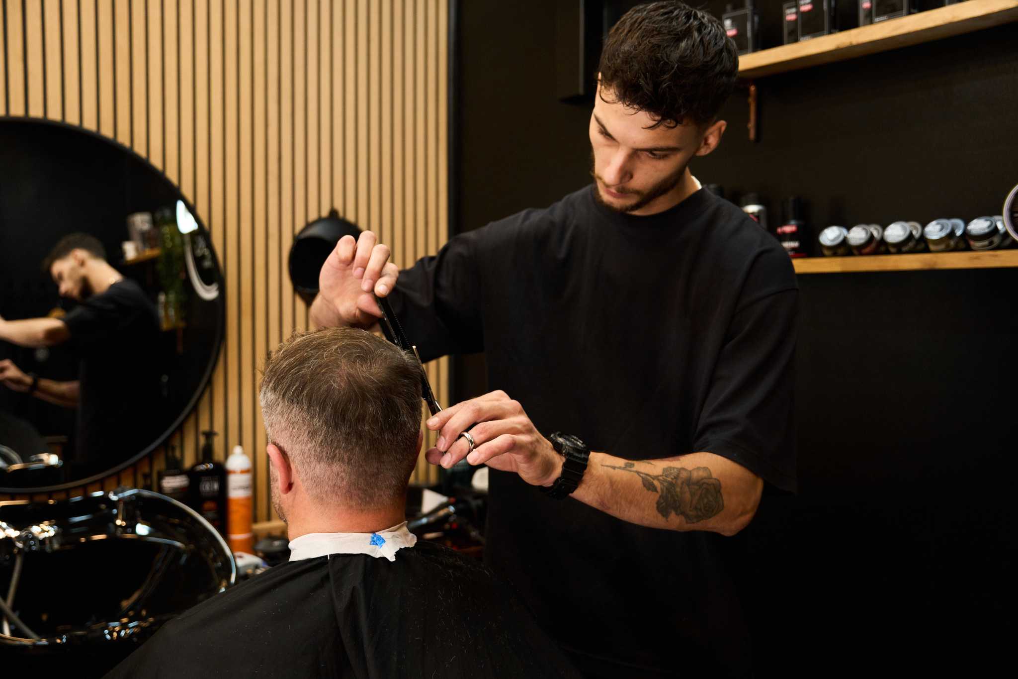 Man getting haircut in Putney