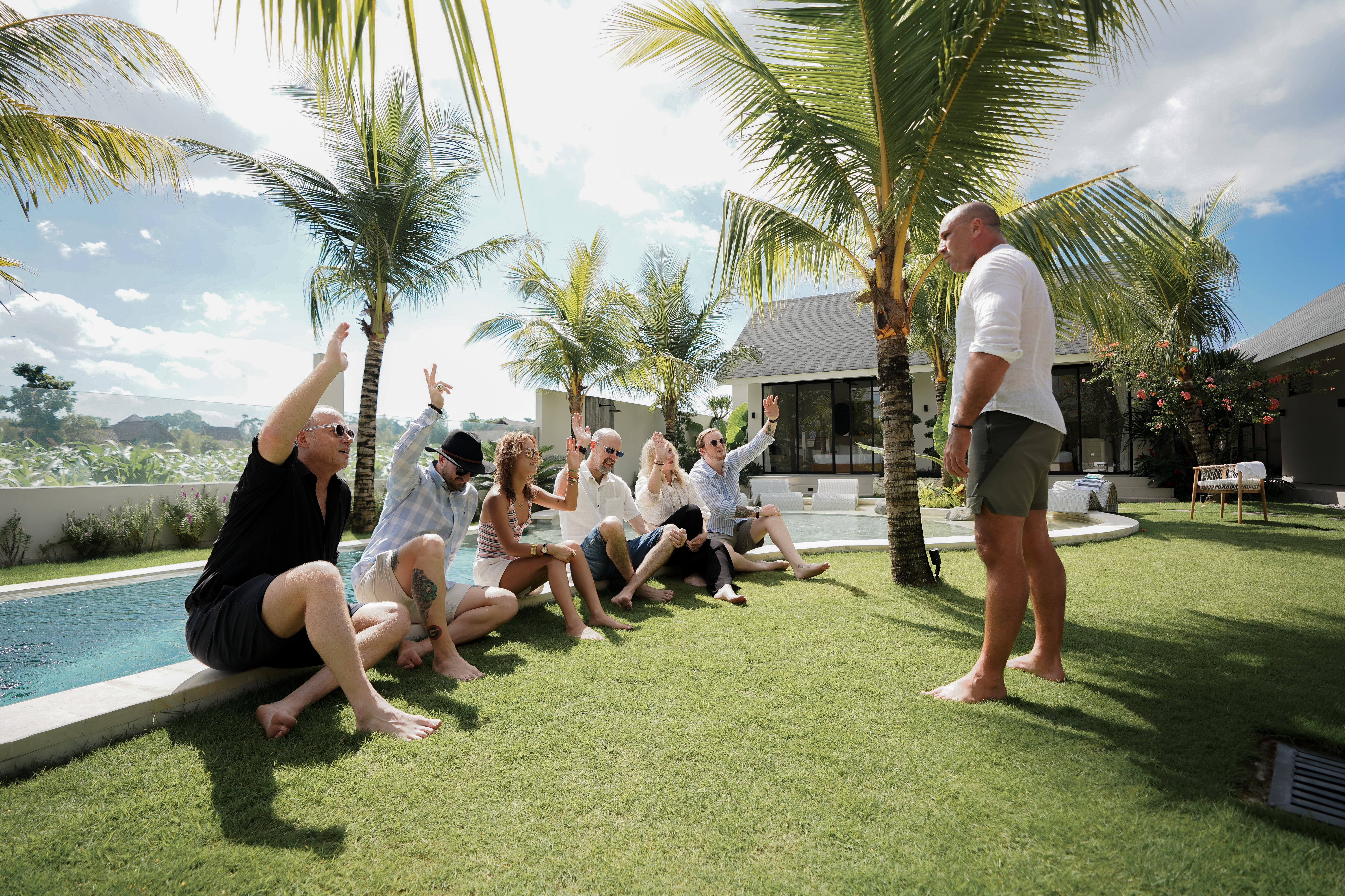 Aaron coaching a group of men in an outdoor setting