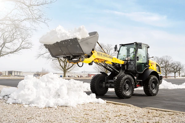 New Holland compact wheel loader handling material on a jobsite