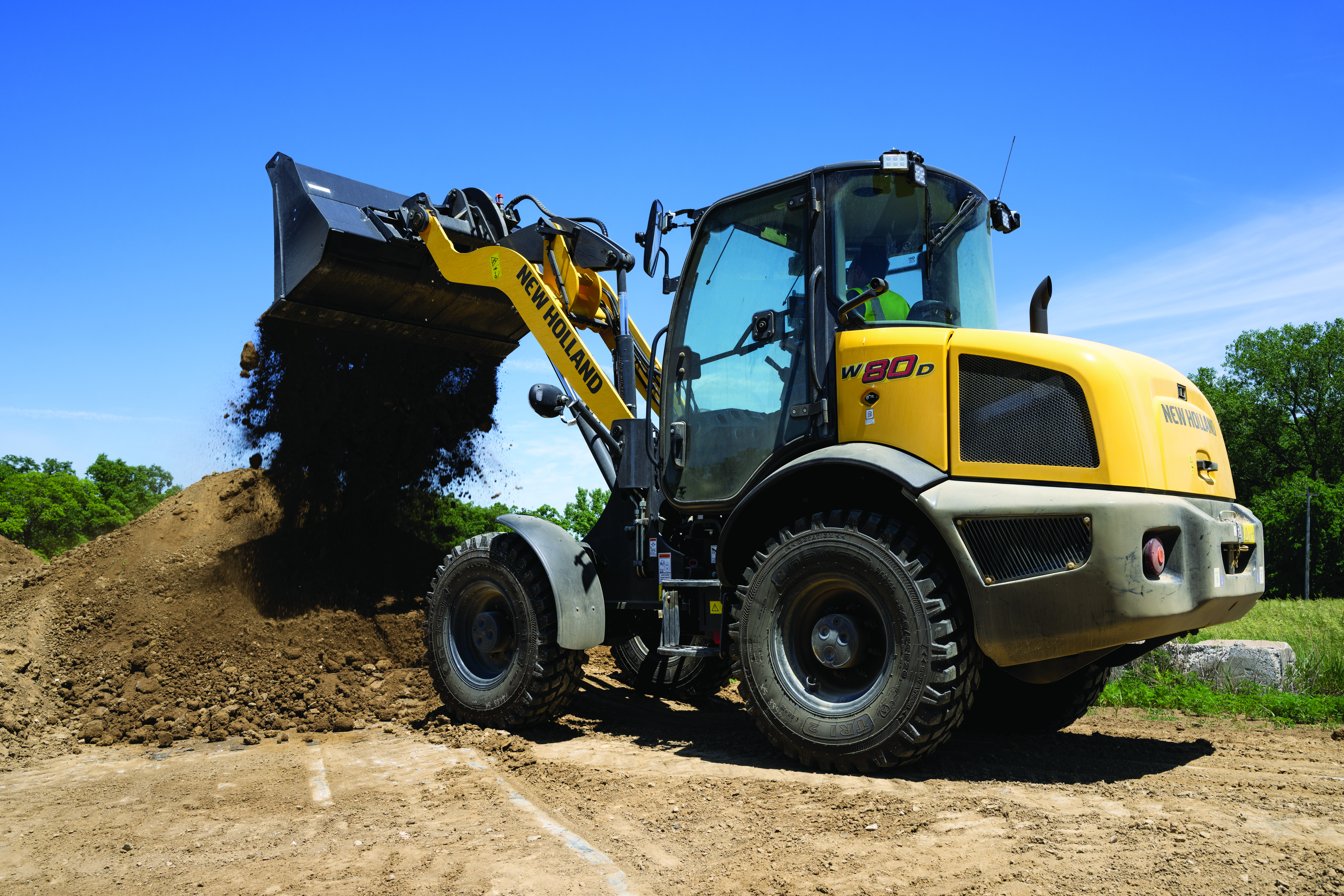 New Holland wheel loader loading a truck on site
