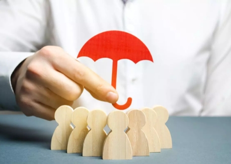 Red Umbrella over wooden figures