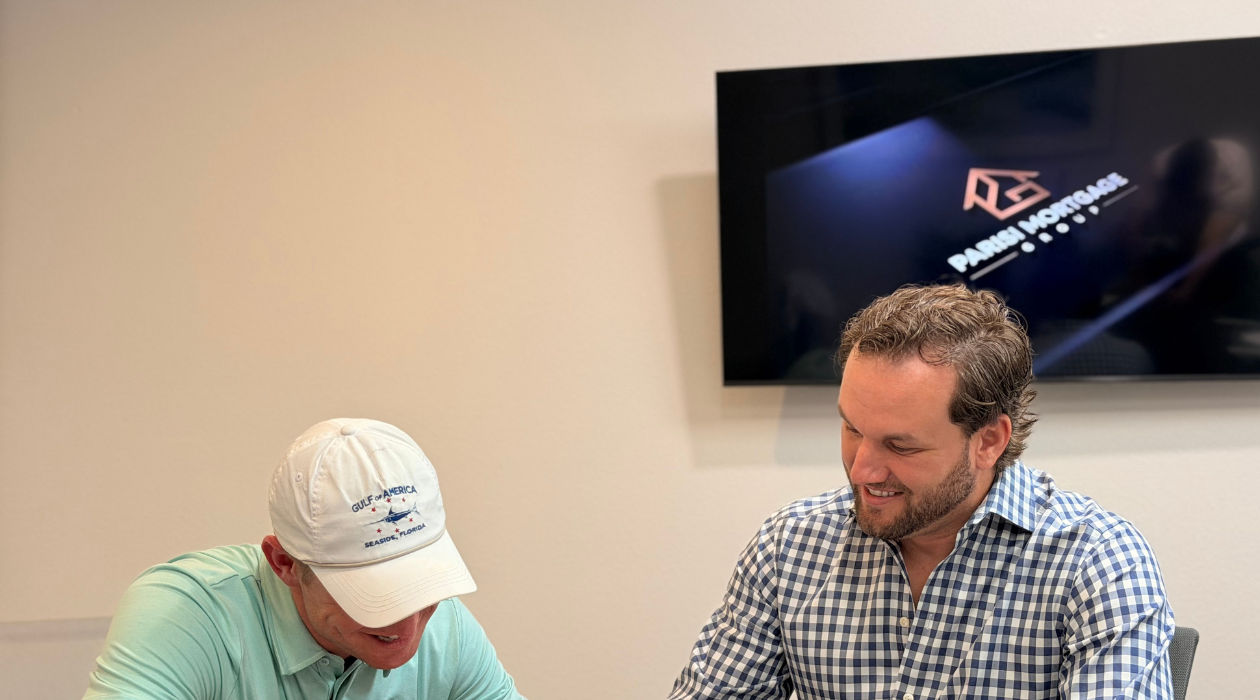 Jonathan Parisi welcoming clients to Parisi Mortgage Group office