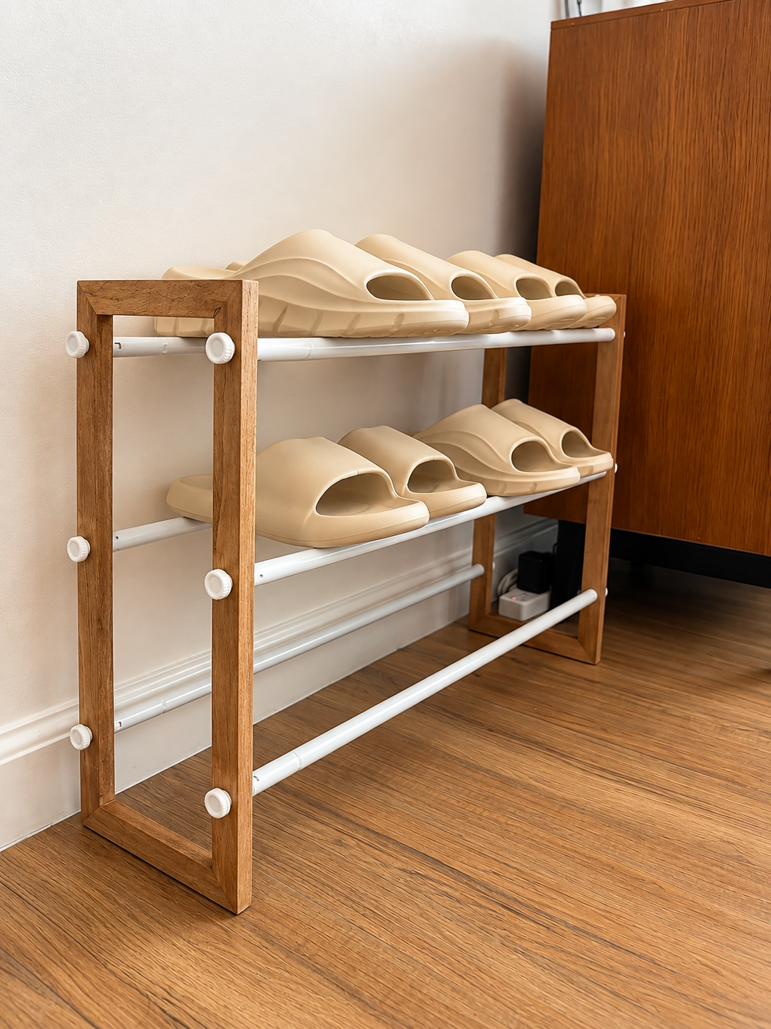Casa Tresoria indoor guest slippers arranged on a shoe rack