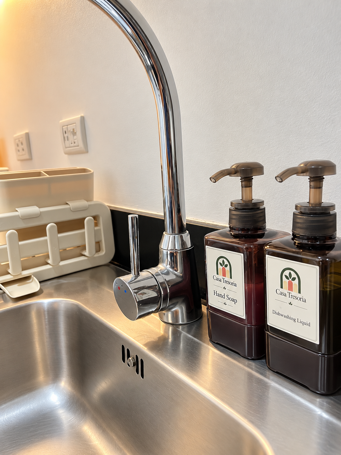 Casa Tresoria kitchen sink with hand soap and dishwashing liquid