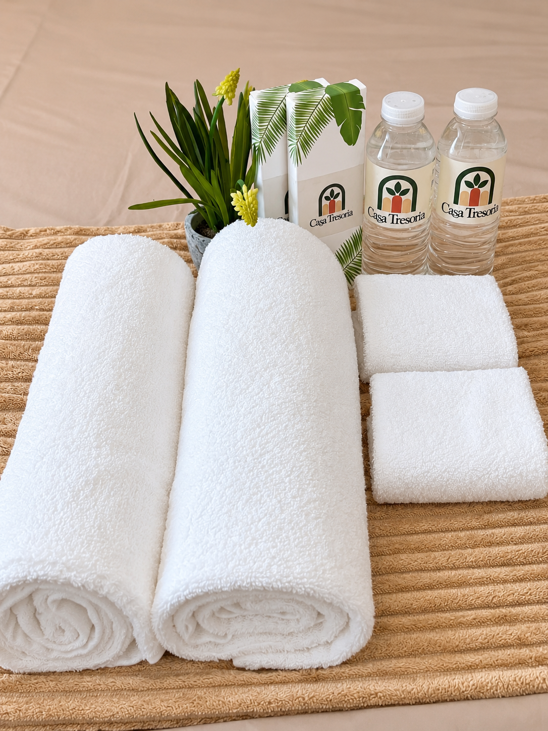 Casa Tresoria fresh towels, drinking water, and guest amenities