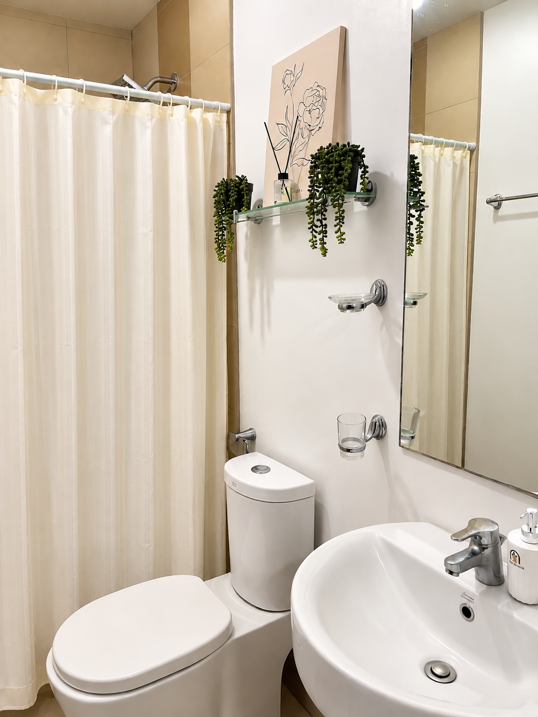 Bathroom with shower, toilet, mirror, and sink in Casa Tresoria Unit 2