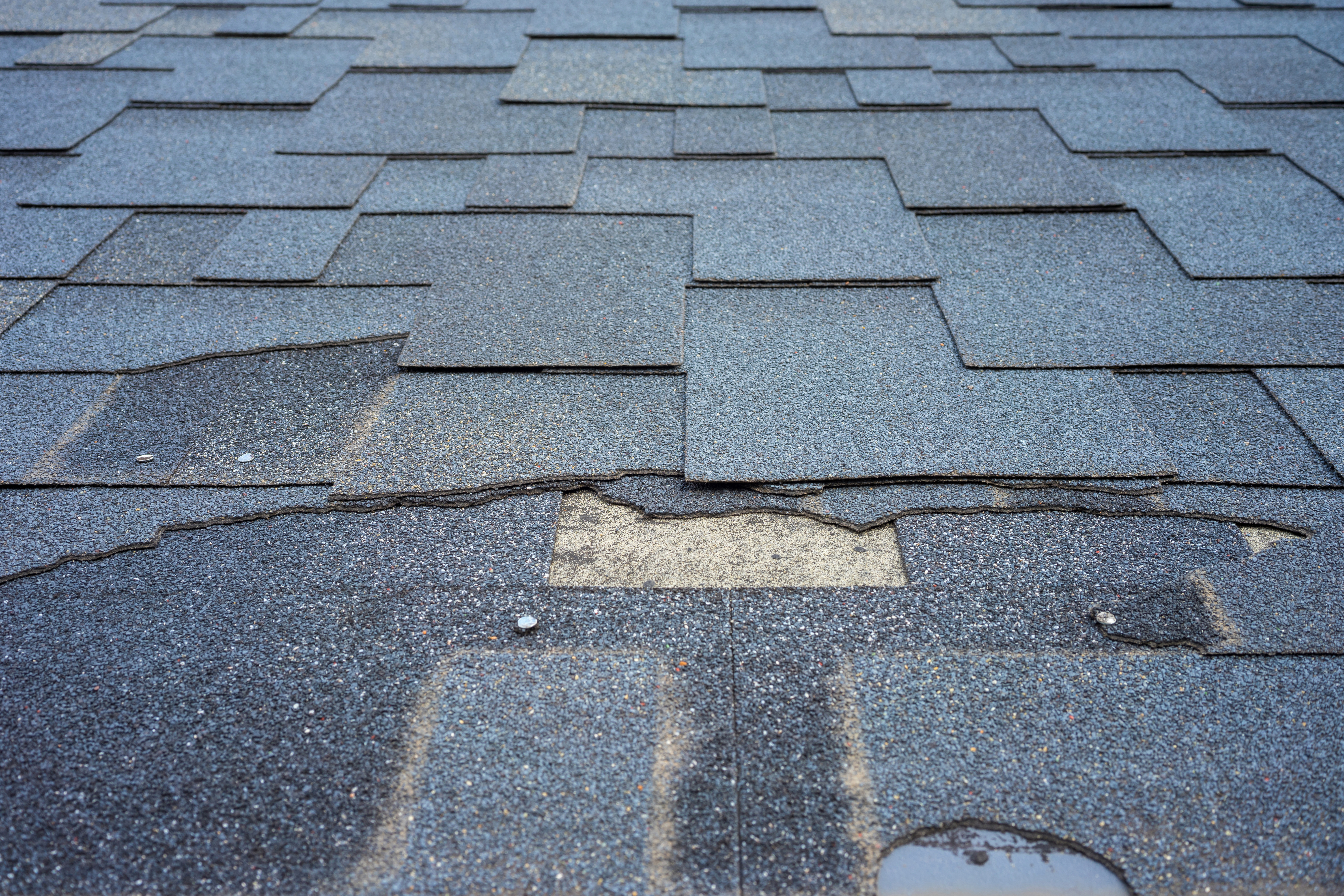 Asphalt shingled roof after stor damage