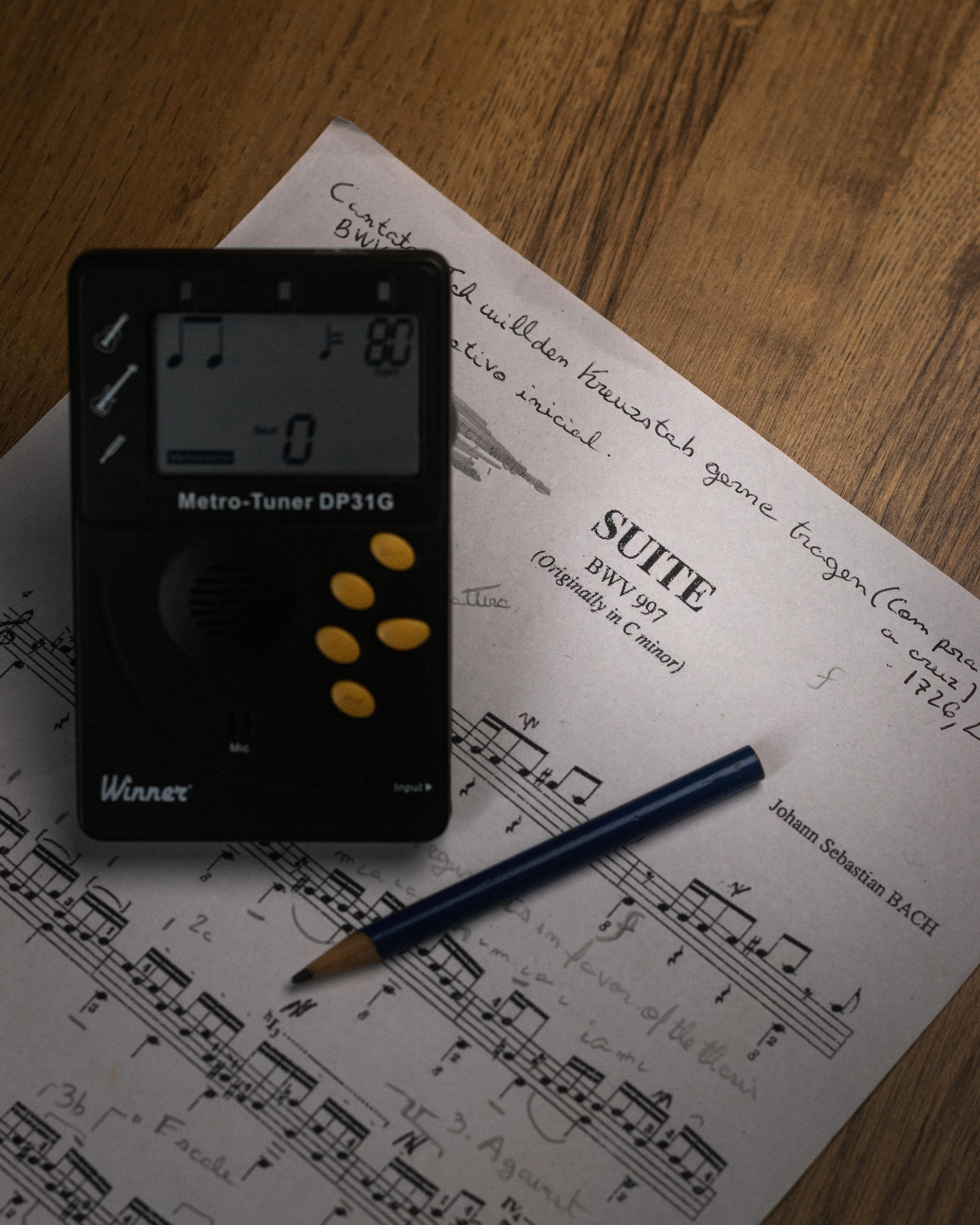 digital metronome on top of sheet music digital metronome on top of sheet music