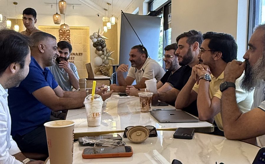 Members networking over coffee