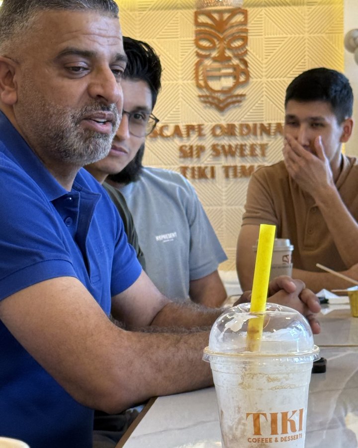 Customers at Tiki Coffee & Desserts with a branded Tiki cup