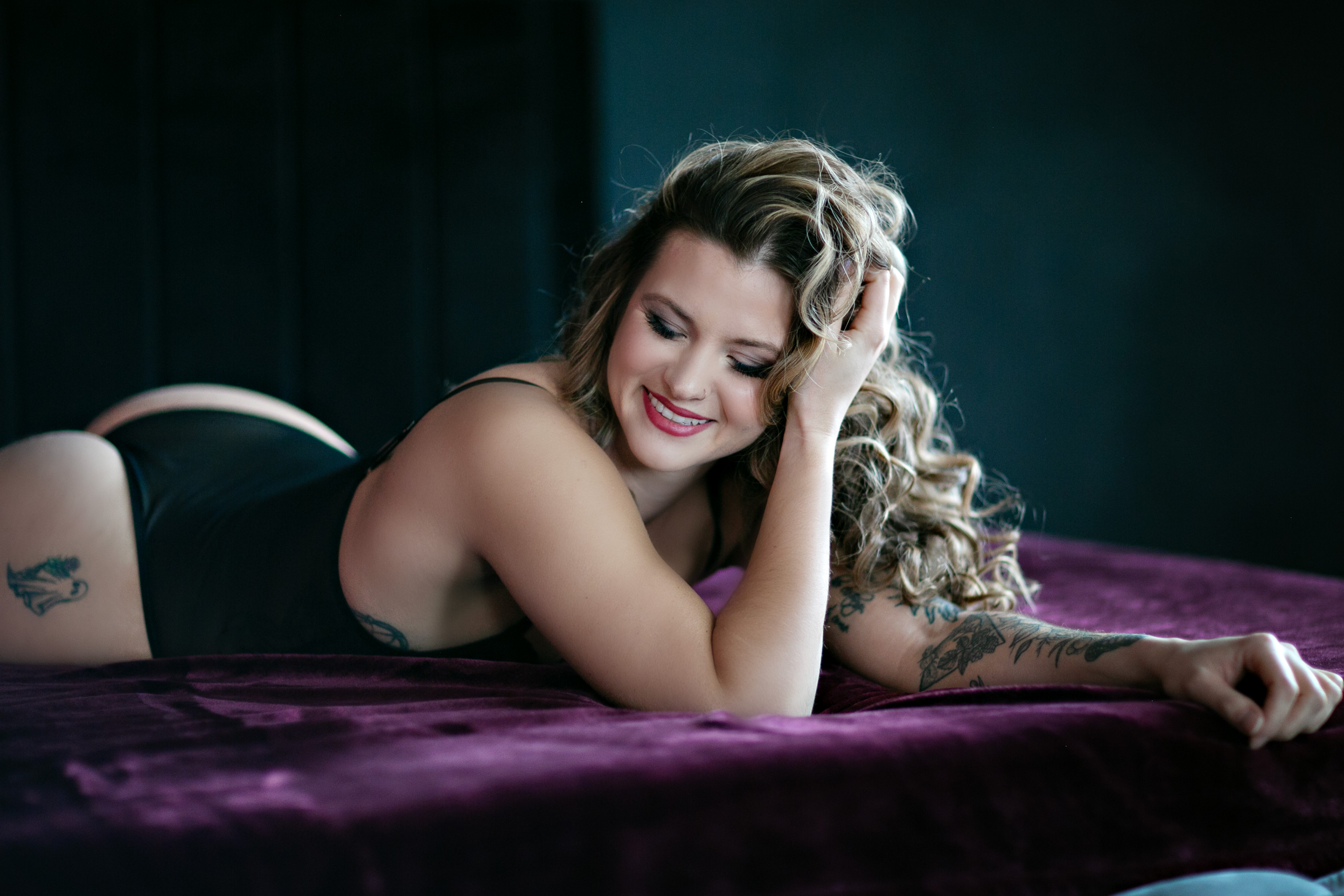 six women wearing white pants posing