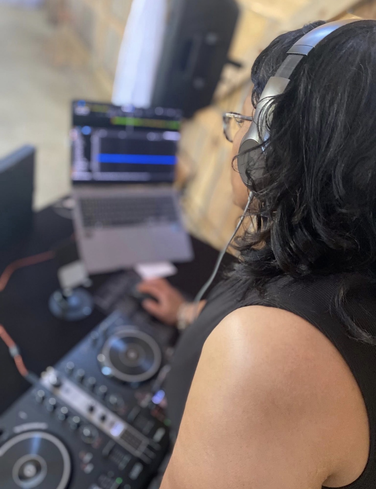 DJ N3NA performing at her DJ equipment