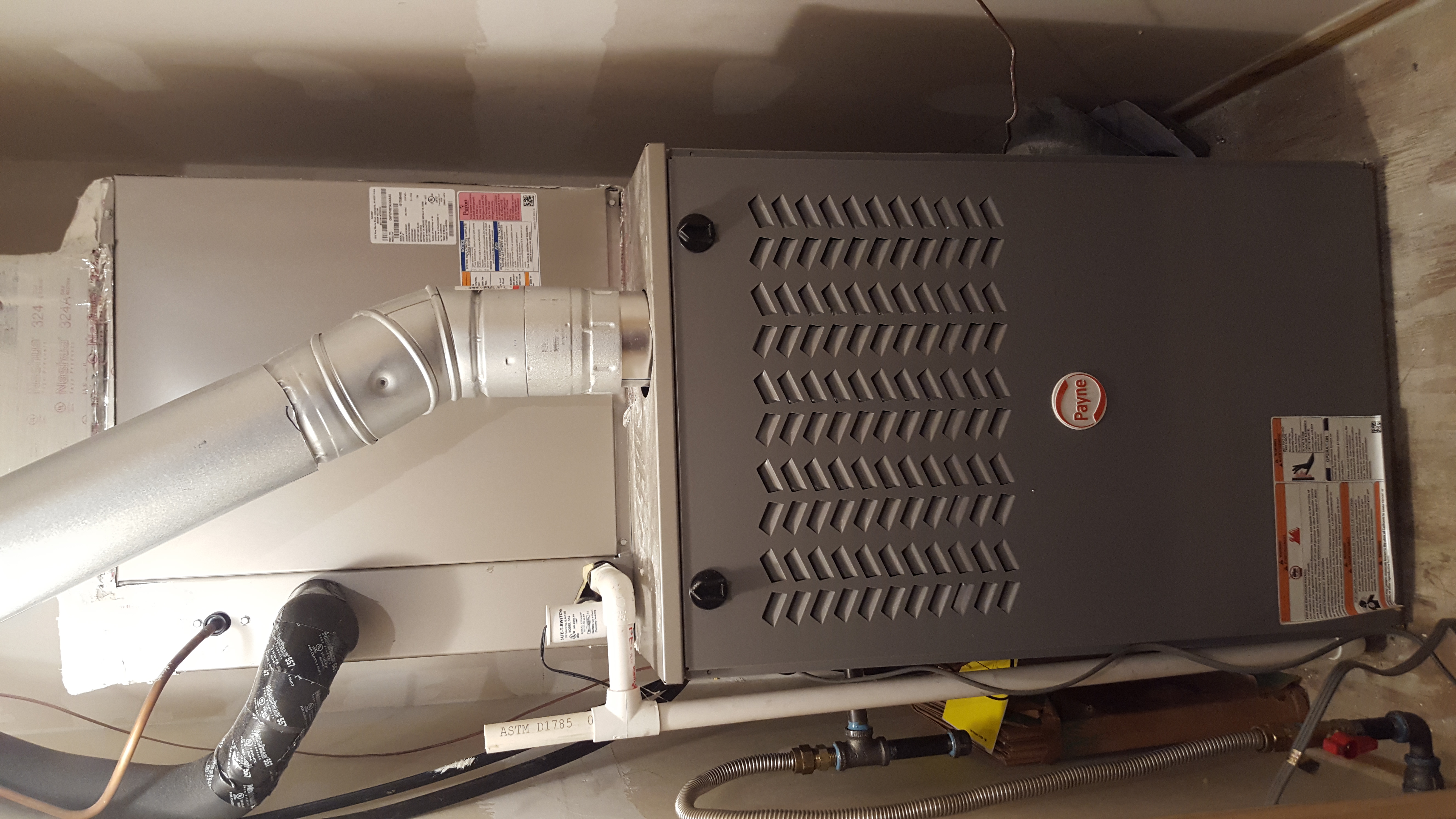Competition A/C & Heat team installing a new furnace and heating system in Texas