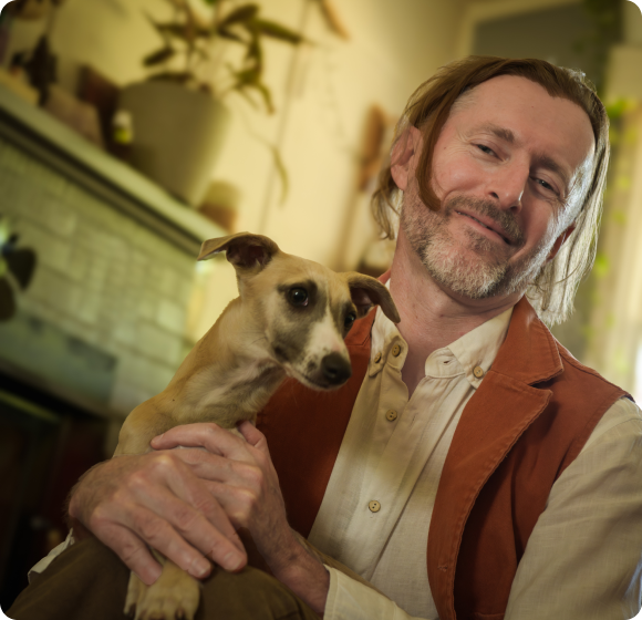 Photo Of Dr. Ed Holding His Dog Gem