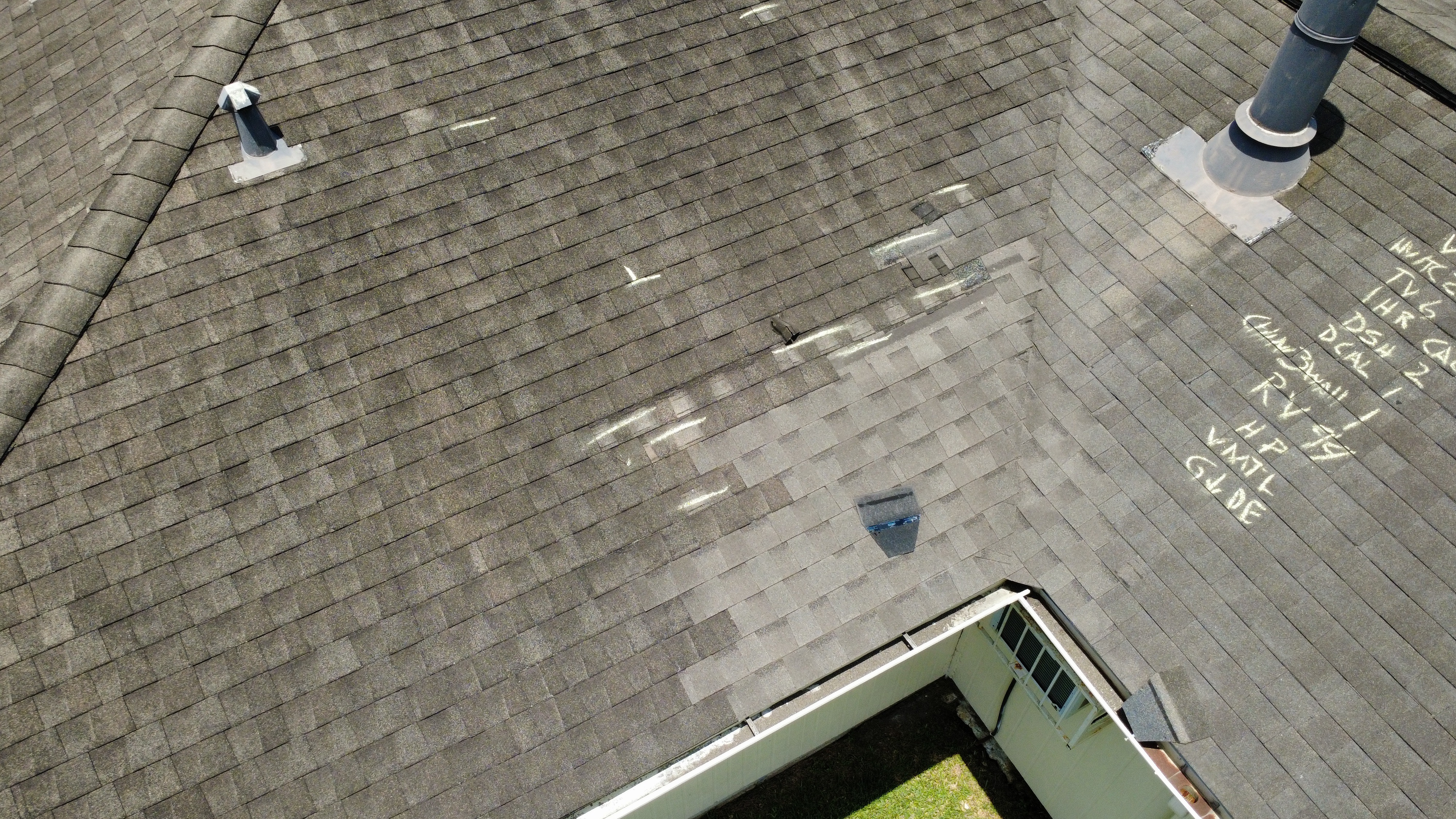 Coreshield roof inspection showing marked damage areas on shingle roof