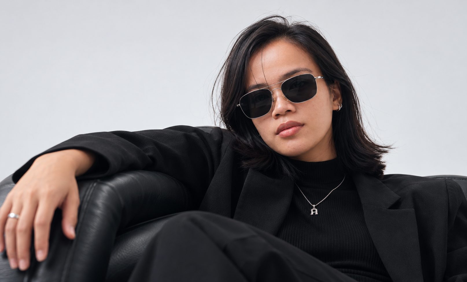 Creative portrait in a black blazer and sunglasses
