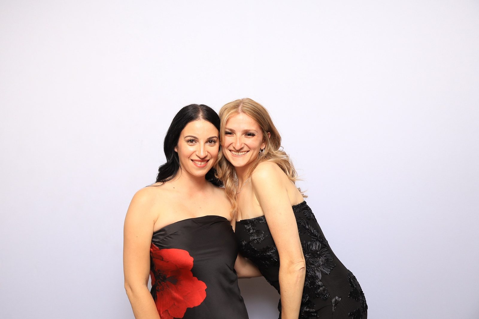 Guests enjoying a photo booth at a Colorado springs gala with martini moment photo booths