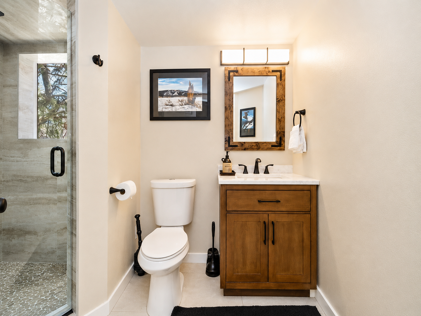 Full bathroom with wood vanity at Bear Summit Hideaway