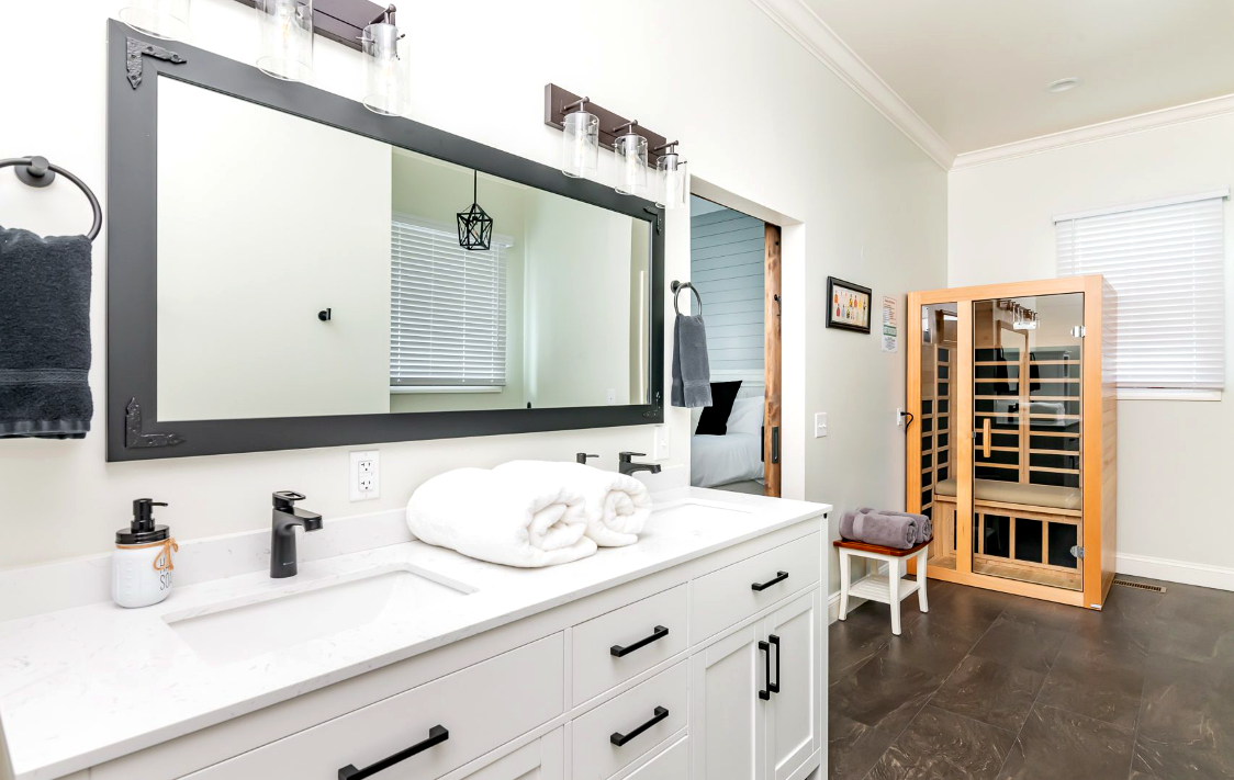 Bright bathroom vanity with folded towels at Bourbon Trail Hideaway