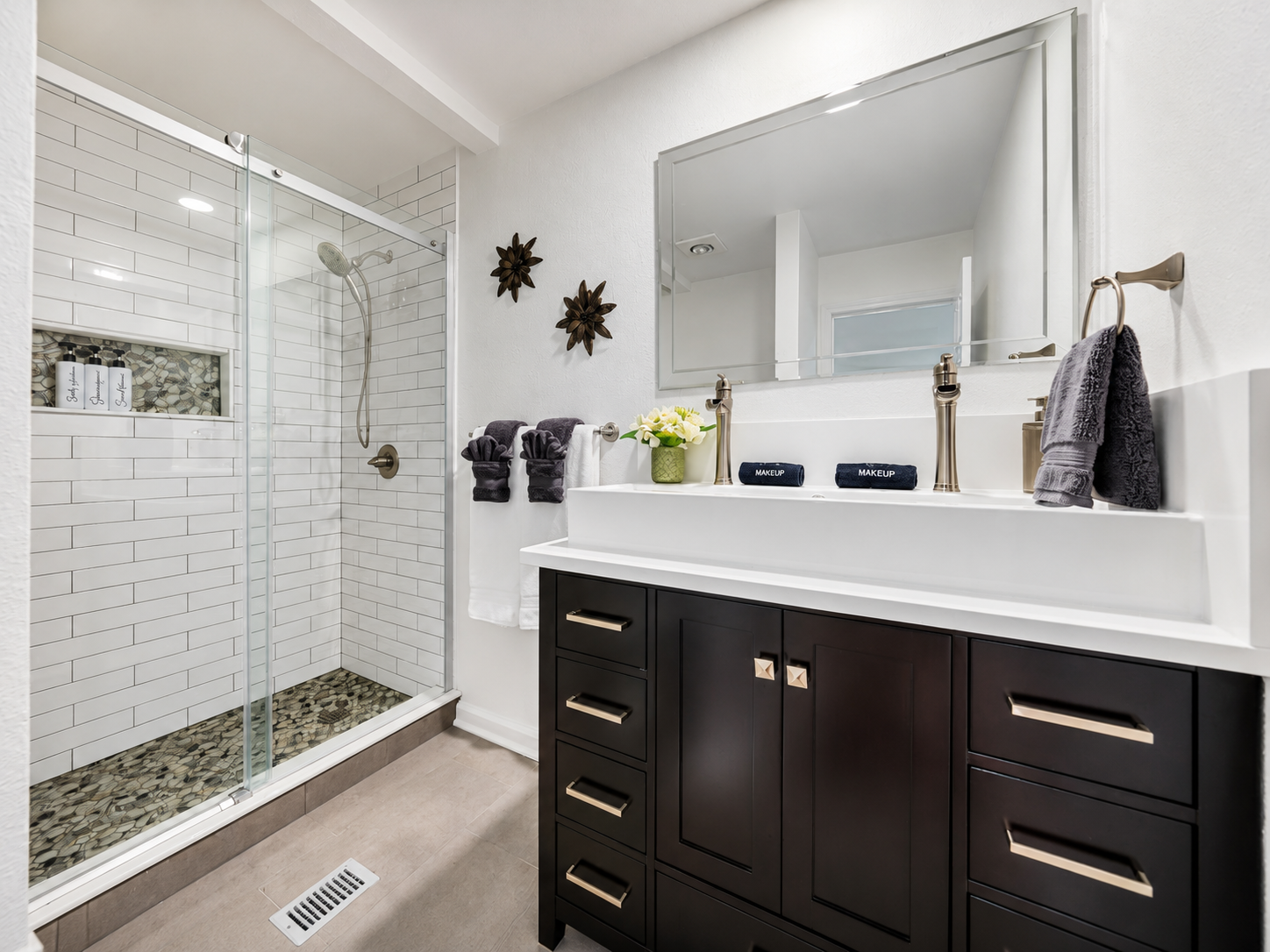 Bathroom vanity and shower at Eagle Point Hideaway