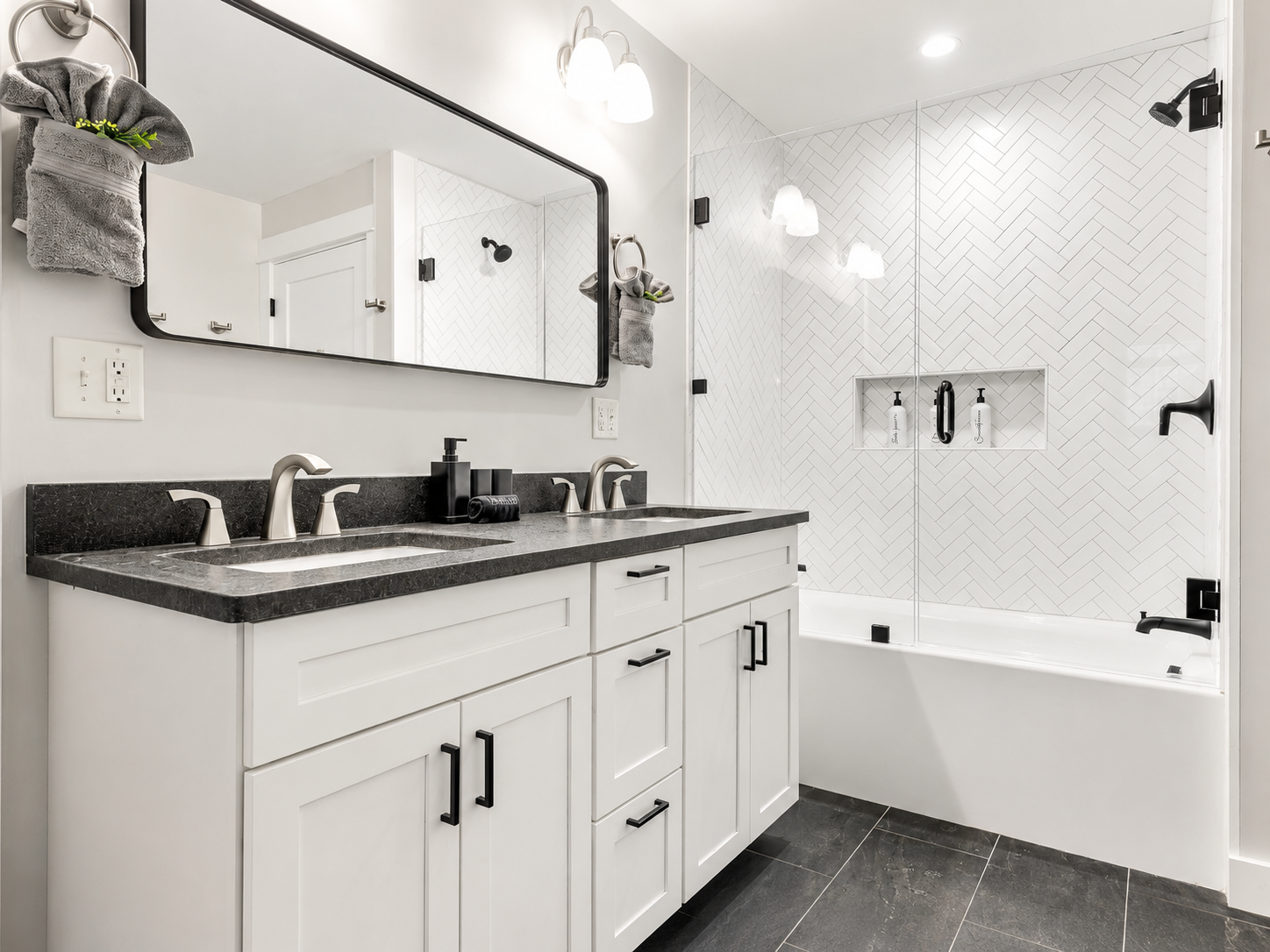 Bathroom vanity with tub and tile shower wall at Sunday Summit Hideaway
