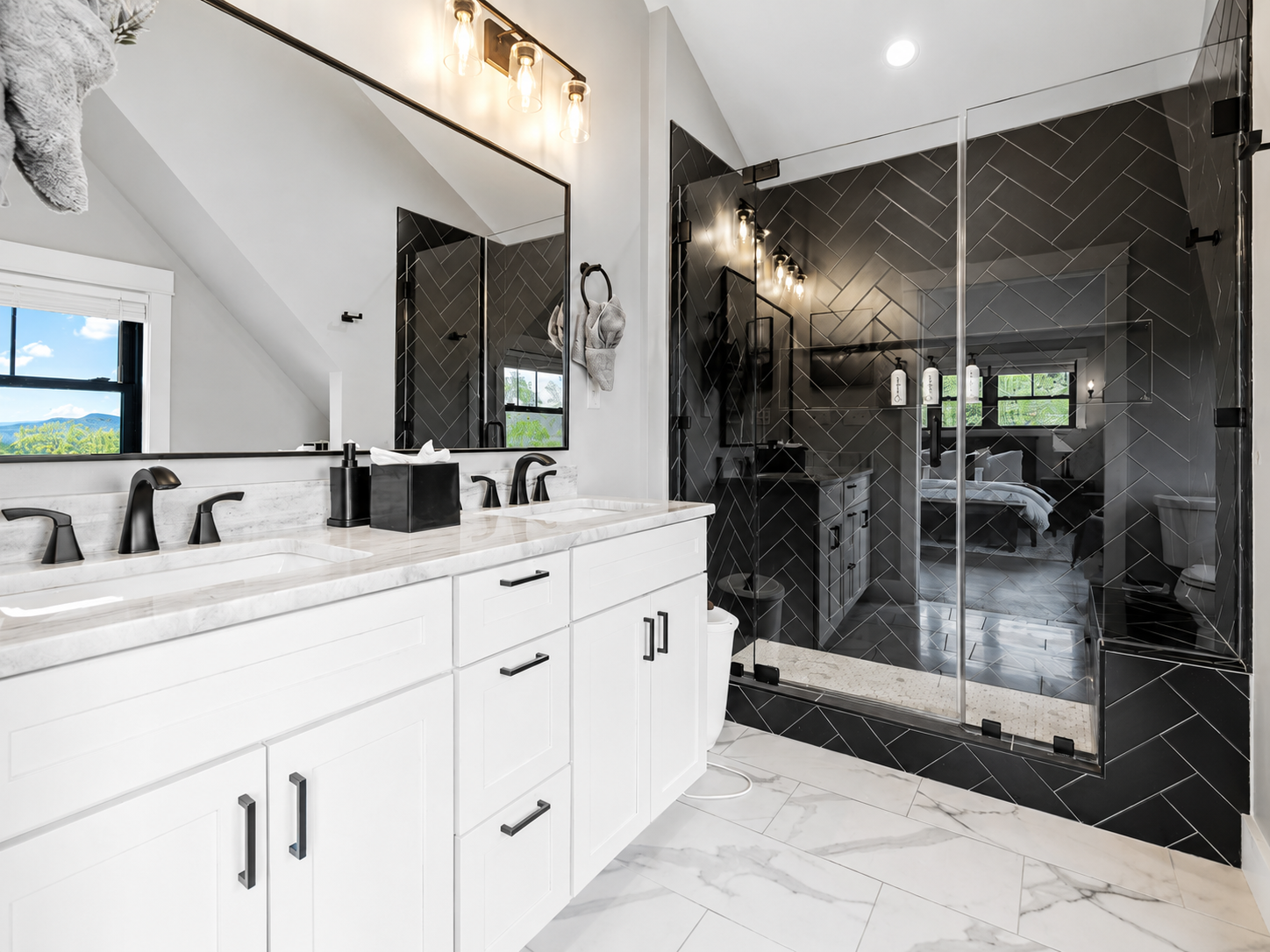 Bright bathroom vanity with glass shower at Sunday Summit Hideaway