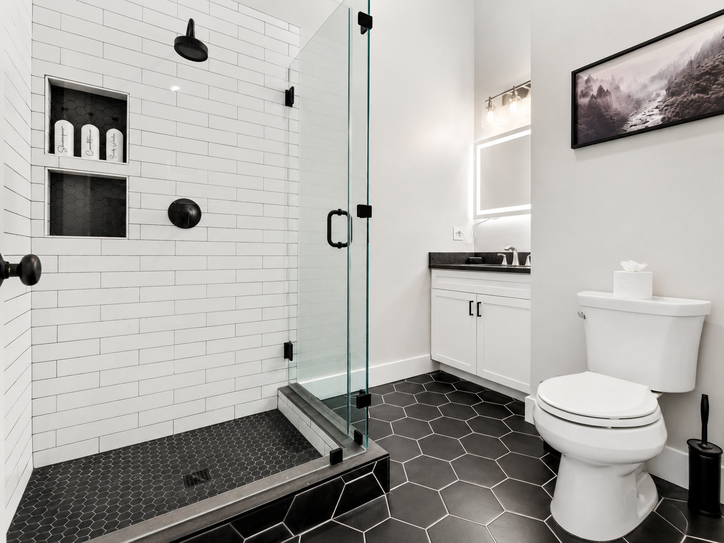 Bathroom with white tile shower and black flooring at Sunday Summit Hideaway