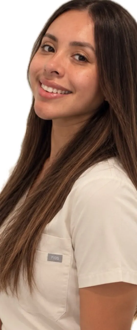 Jennifer Velazquez, RN, owner of JENNVIE Med Spa in Westport, CT, in cream scrubs