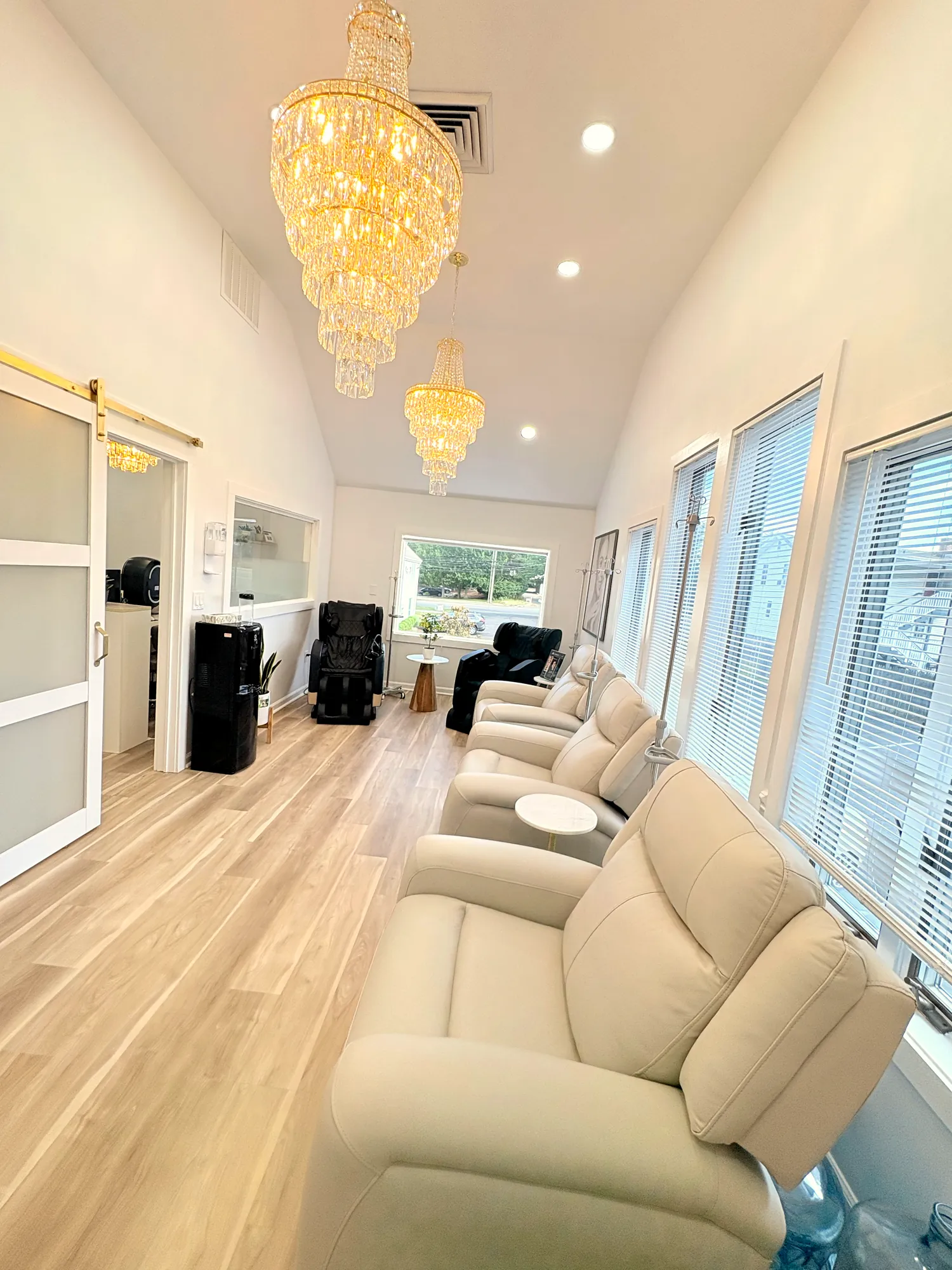 IV lounge with chandeliers at JENNVIE Med Spa in Westport, near Weston, CT