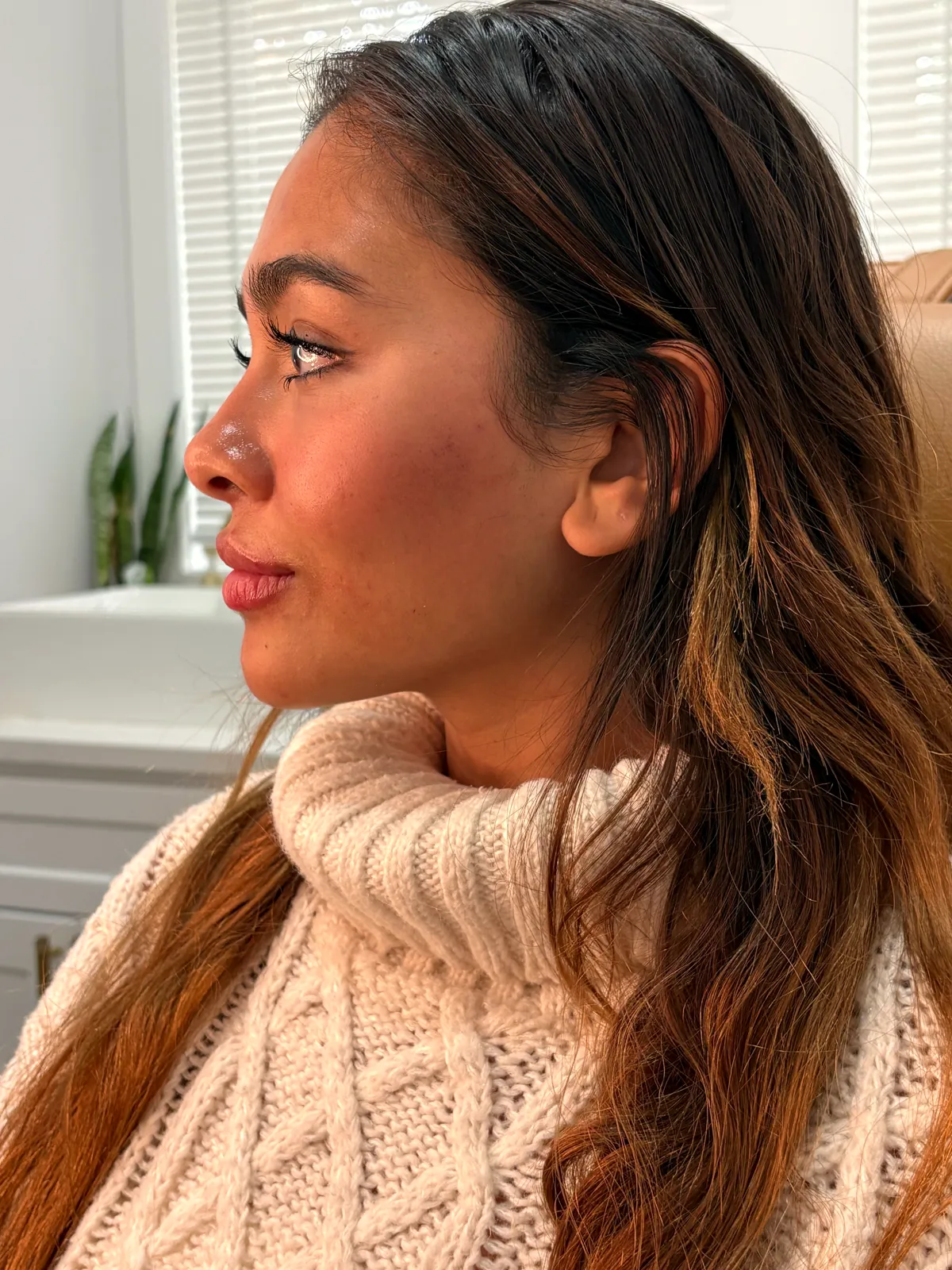 JENNVIE client in a cream turtleneck at the med spa in Westport, CT