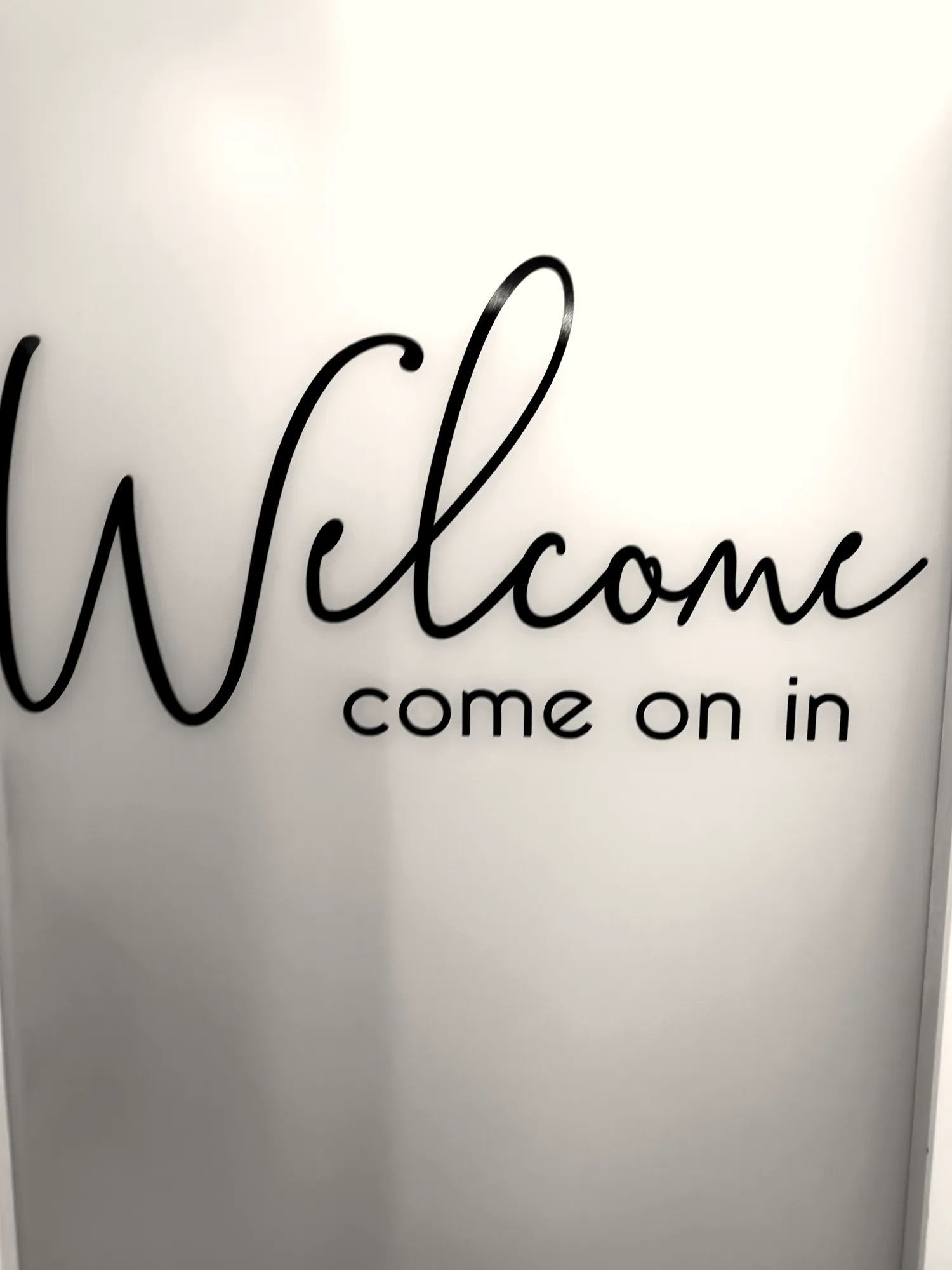 Welcome, come on in sign on the door at JENNVIE Med Spa in Westport, CT