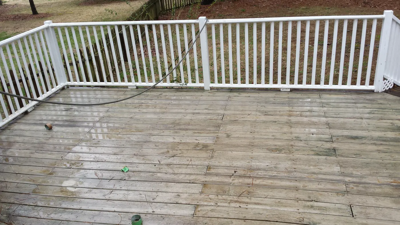 Wooden deck before and after pressure washing