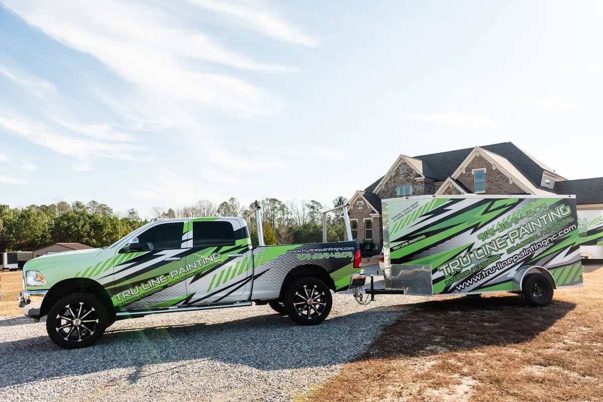Tru-Line Painting truck and trailer with lime green and black racing stripe wrap
