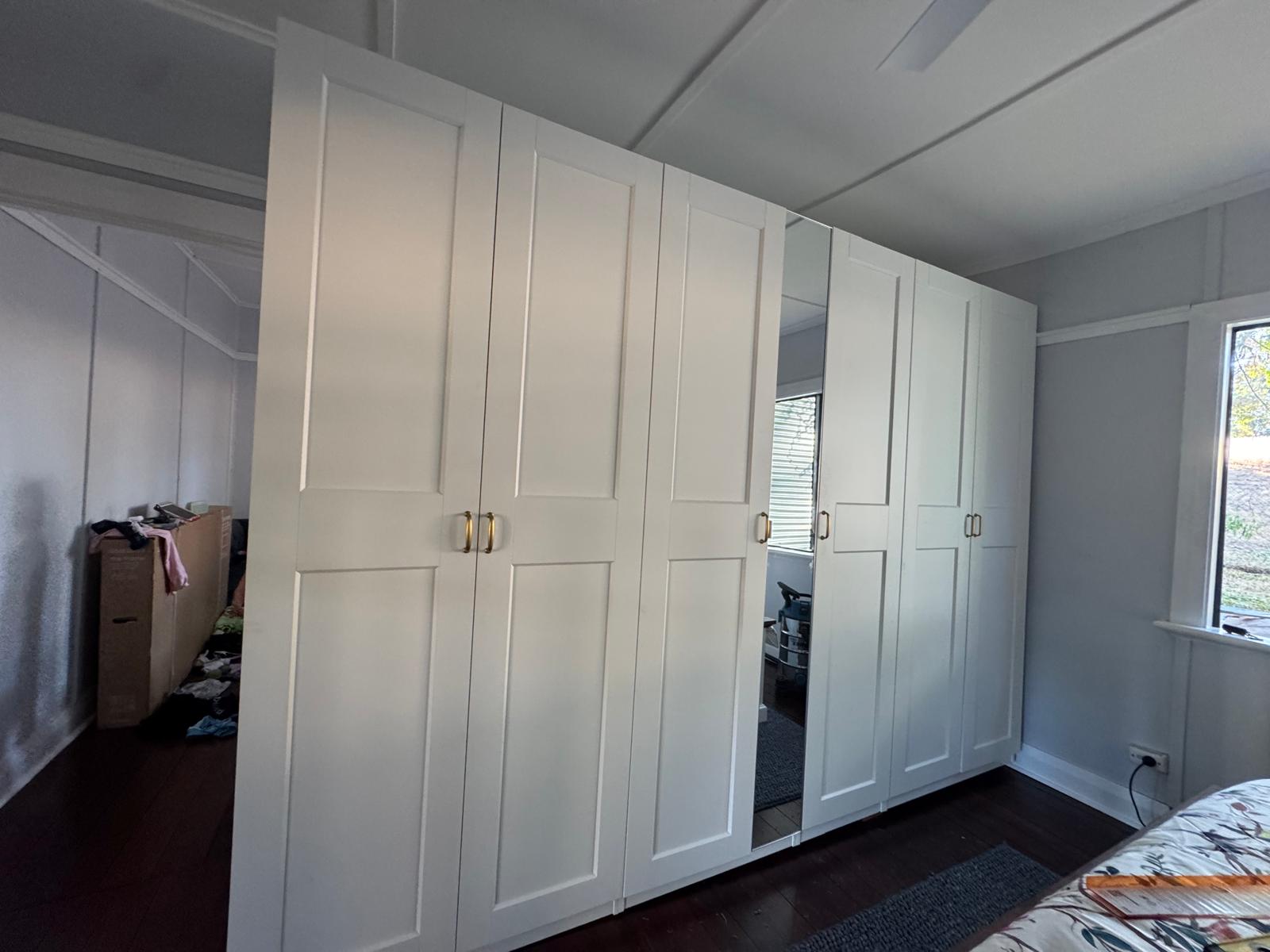White wardrobe with hinged and mirrored doors in Perth
