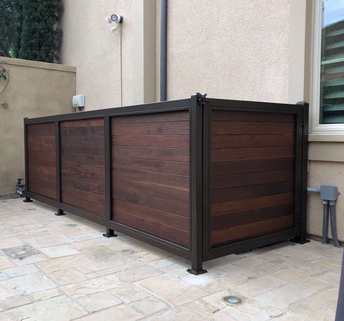 Steel frame wood privacy patio railing with horizontal panels