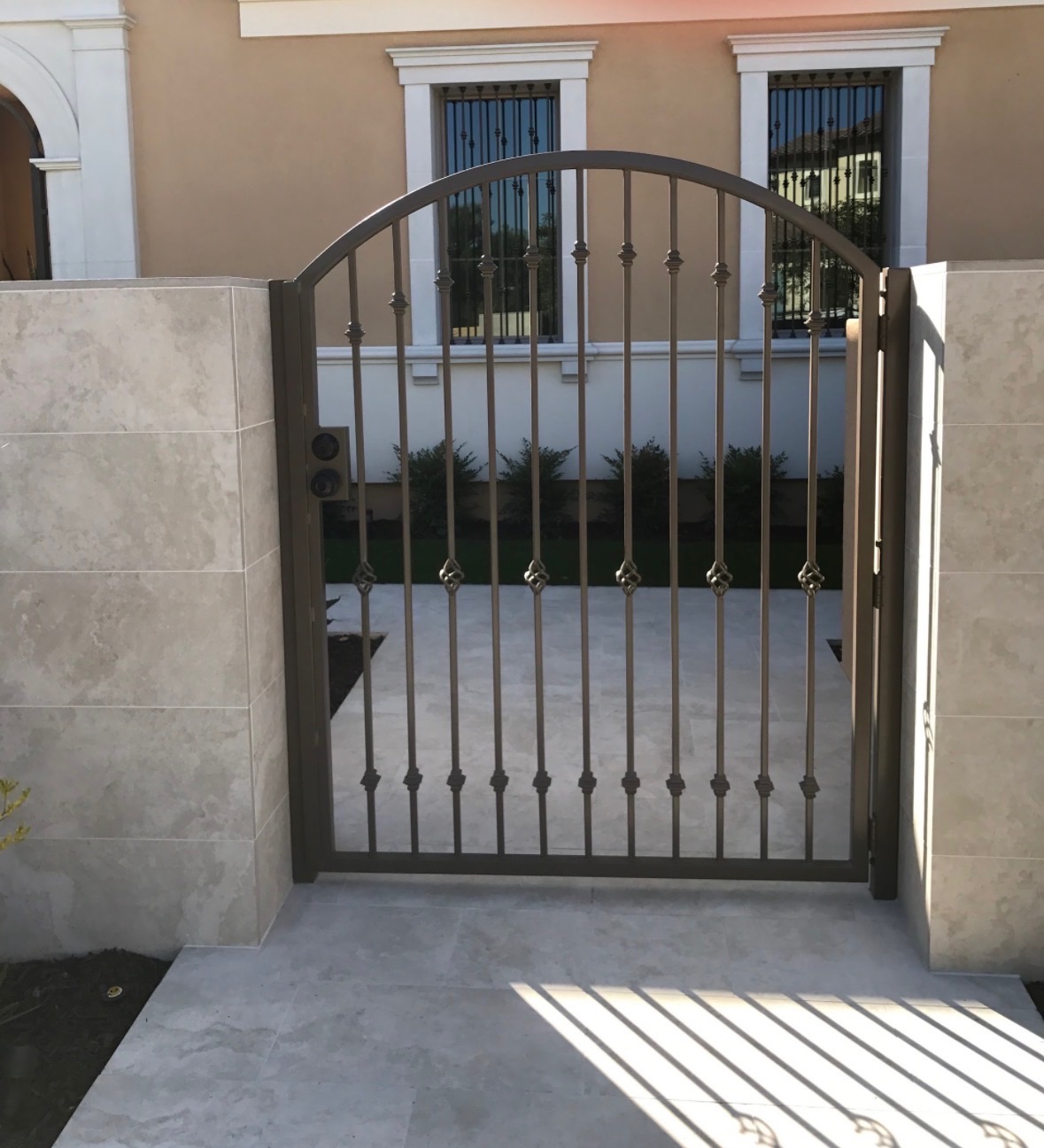 Ornamental iron gate panel repair with matching finish