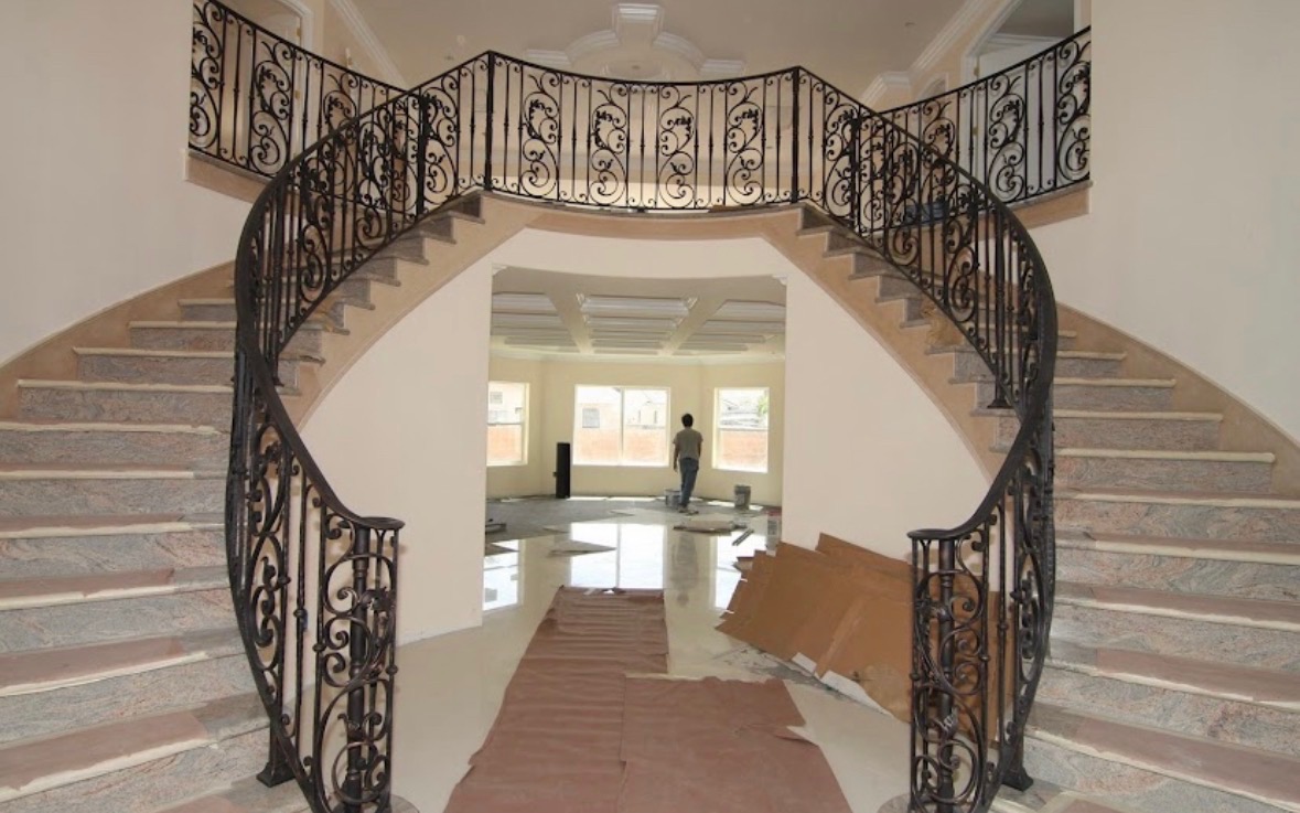 Custom wrought iron balcony railing in a luxury estate setting
