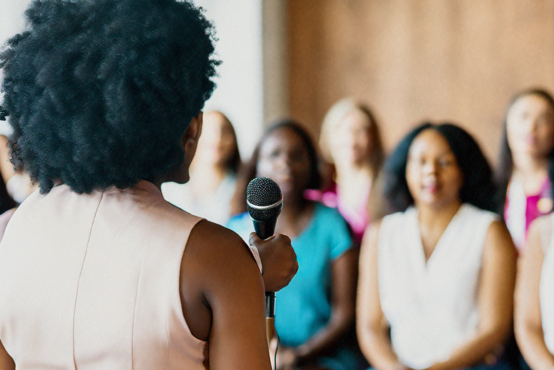 Woman speaking to a group of women