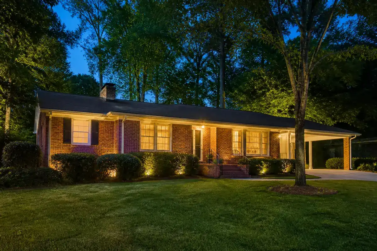 Brick ranch home at dusk