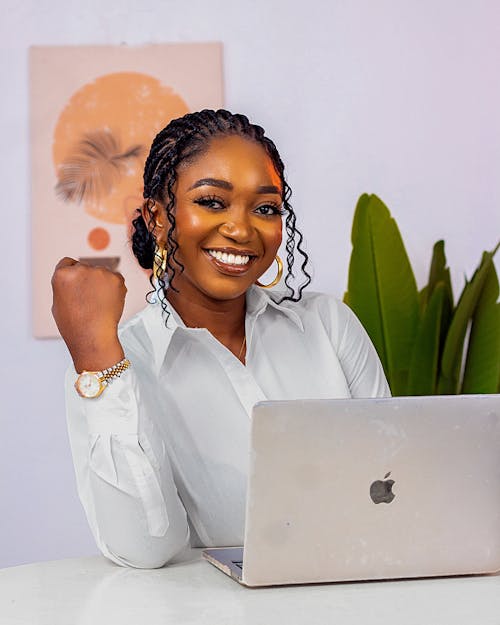 Beauty entrepreneur working on a laptop for an upgraded Shopify beauty store