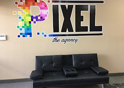 Pixel Agency office wall mural with oversized pixel-art typography