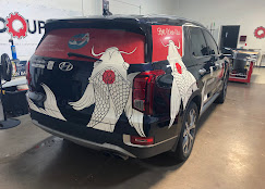 Custom artistic koi fish full vehicle wrap on black SUV
