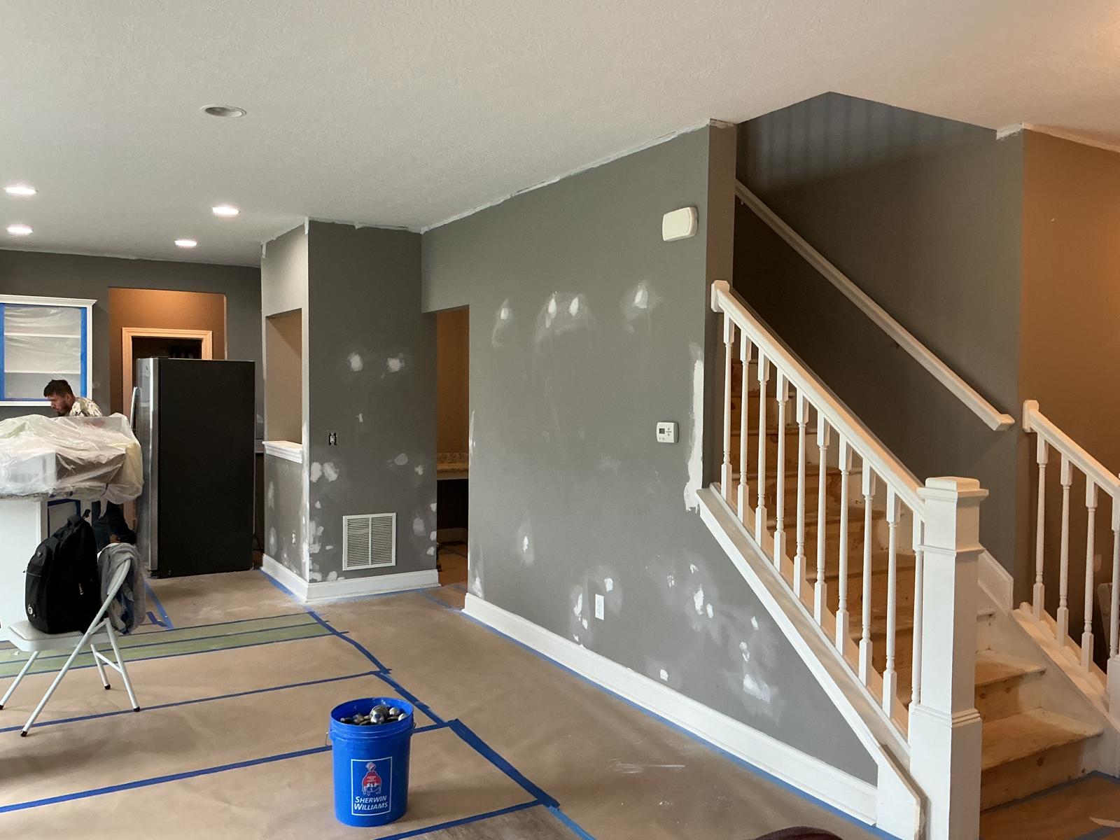 White painted room with green LED accent lighting and cabinets