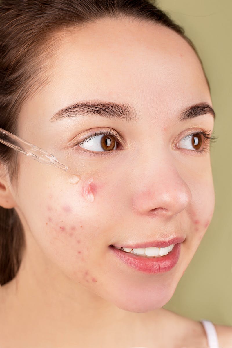 Woman applying skincare serum