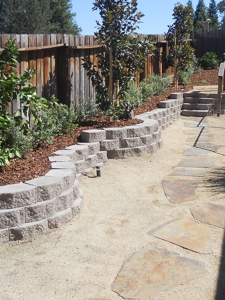 Hardscape retaining wall, steps, and pathway construction by Lavish Gardens Landscape