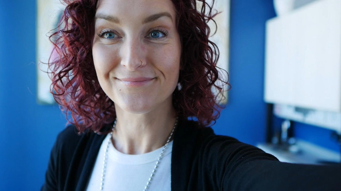 Jolene, curly hair stylist, smiling in her salon studio Jolene, curly hair stylist, smiling in her salon studio